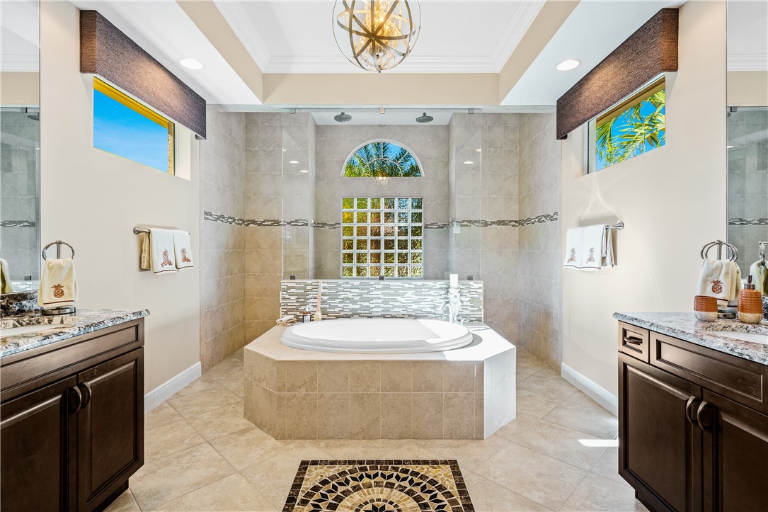 8250 Halbert Lane Vero Beach, FL 32968 - Photo 21 of 36 a bathroom with a sink a bathtub and a window