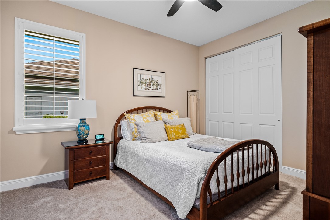 8250 Halbert Lane Vero Beach, FL 32968 - Photo 24 of 36 a bedroom with a bed and a window