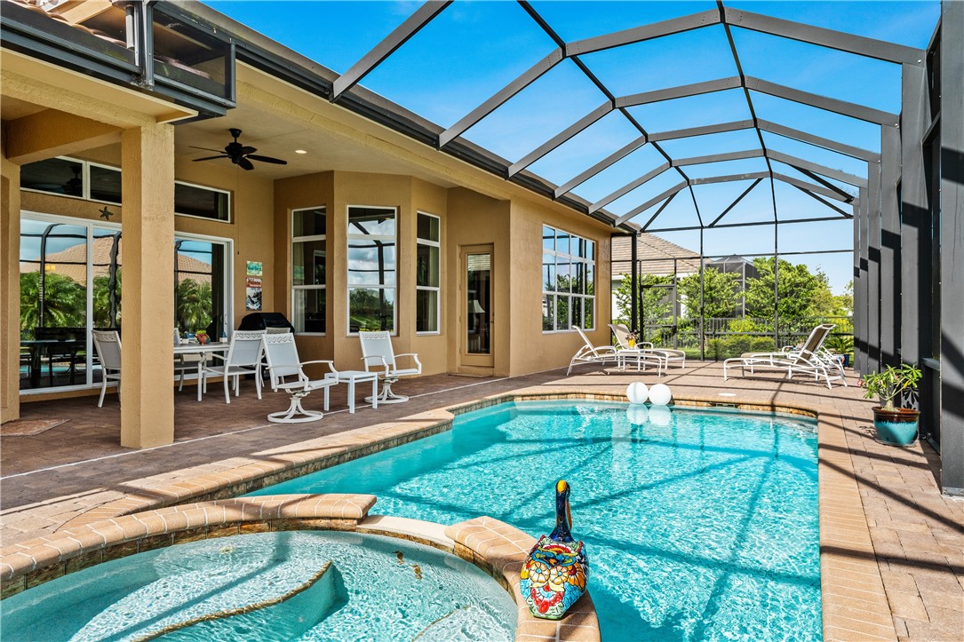 8250 Halbert Lane Vero Beach, FL 32968 - Photo 28 of 36 a swimming pool with outdoor seating and yard