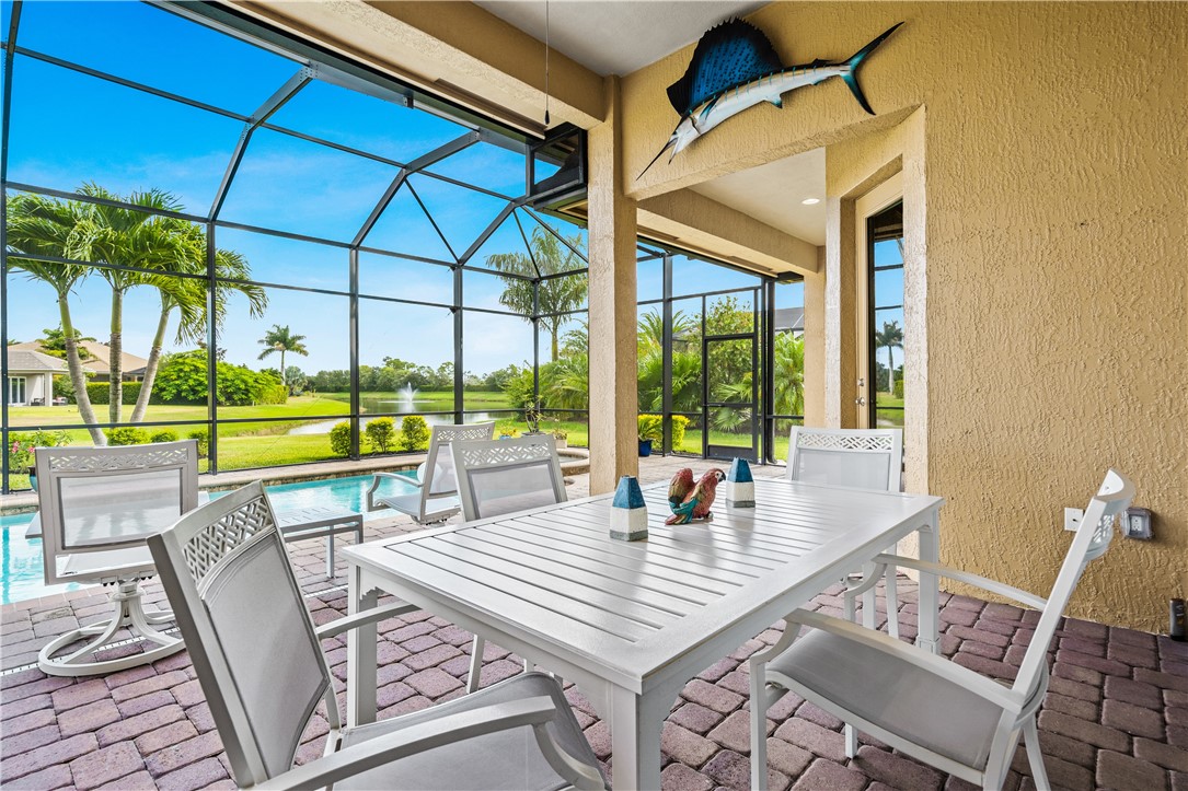8250 Halbert Lane Vero Beach, FL 32968 - Photo 31 of 36 a dining room with furniture and a floor to ceiling window