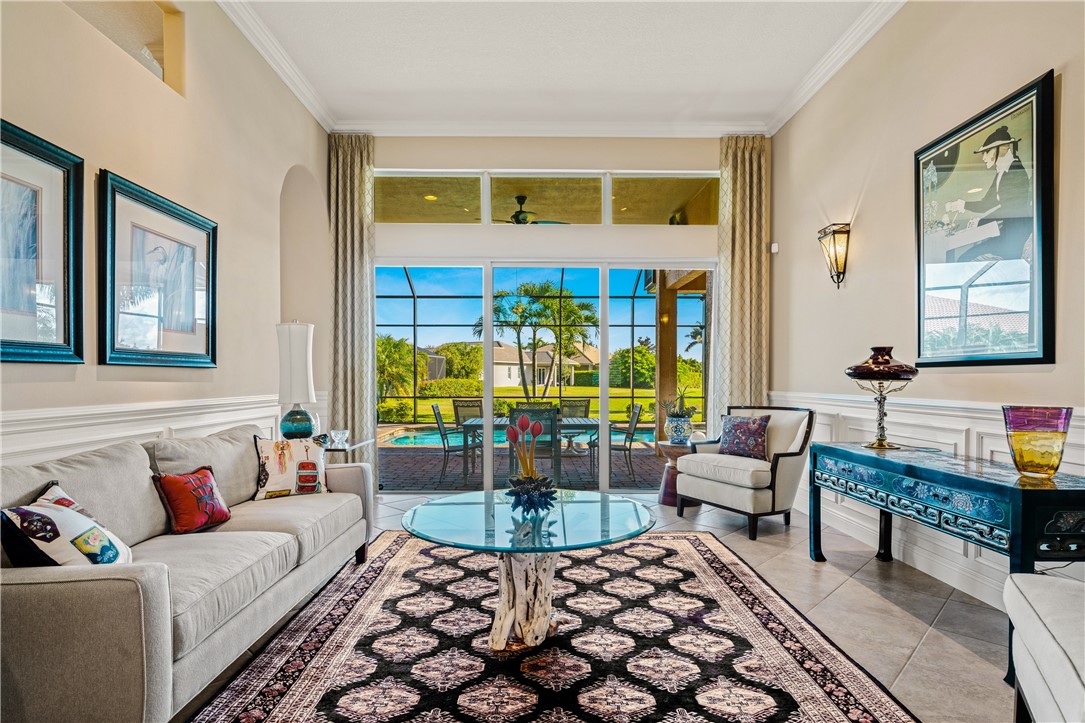 8250 Halbert Lane Vero Beach, FL 32968 - Photo 4 of 36 a living room with fireplace furniture and a window