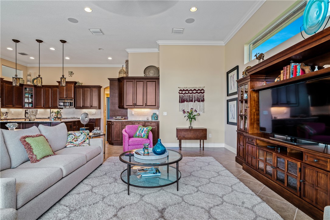 8250 Halbert Lane Vero Beach, FL 32968 - Photo 9 of 36 a living room with furniture and a flat screen tv