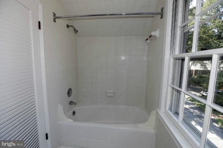 5039 Overlook Road Northwest Washington, DC 20016 - Photo 2 of 27 a bathroom with a shower and a bathtub
