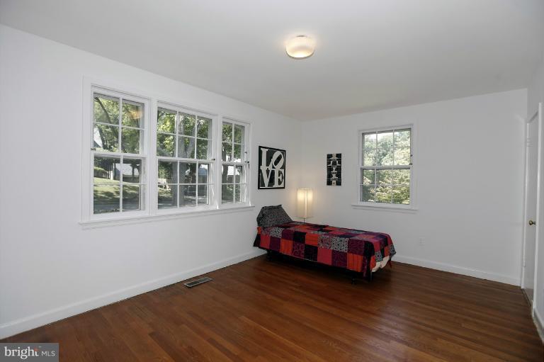 5039 Overlook Road Northwest Washington, DC 20016 - Photo 13 of 27 a room with wooden floor and windows