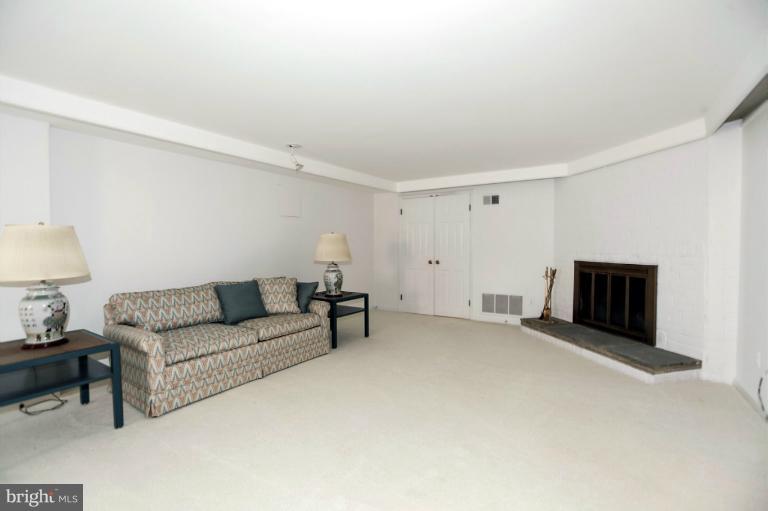 5039 Overlook Road Northwest Washington, DC 20016 - Photo 14 of 27 a living room with furniture and a couch