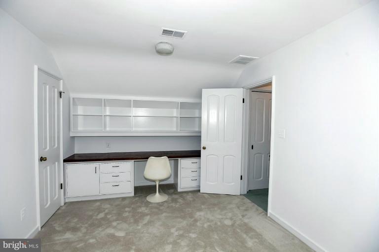 5039 Overlook Road Northwest Washington, DC 20016 - Photo 18 of 27 a view of room with a chair and cabinets