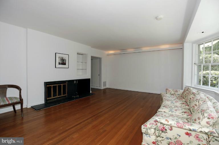 5039 Overlook Road Northwest Washington, DC 20016 - Photo 3 of 27 a bedroom with a bed and a fireplace