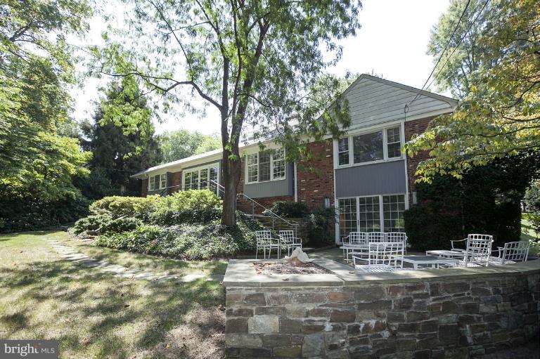 5039 Overlook Road Northwest Washington, DC 20016 - Photo 21 of 27 a front view of a house with a yard