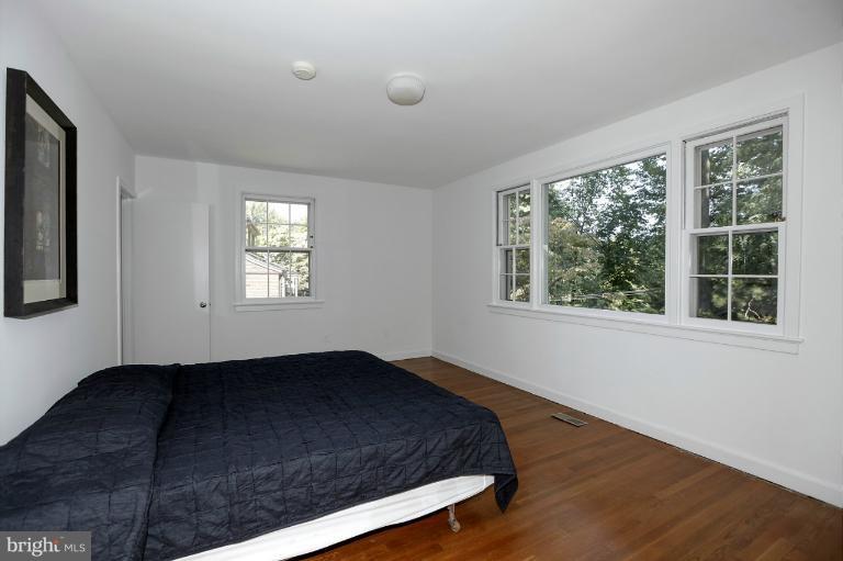 5039 Overlook Road Northwest Washington, DC 20016 - Photo 4 of 27 a bedroom with a bed and a window