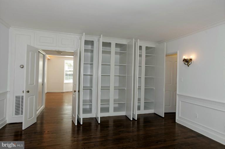 5039 Overlook Road Northwest Washington, DC 20016 - Photo 9 of 27 wooden floor in an empty room with a window
