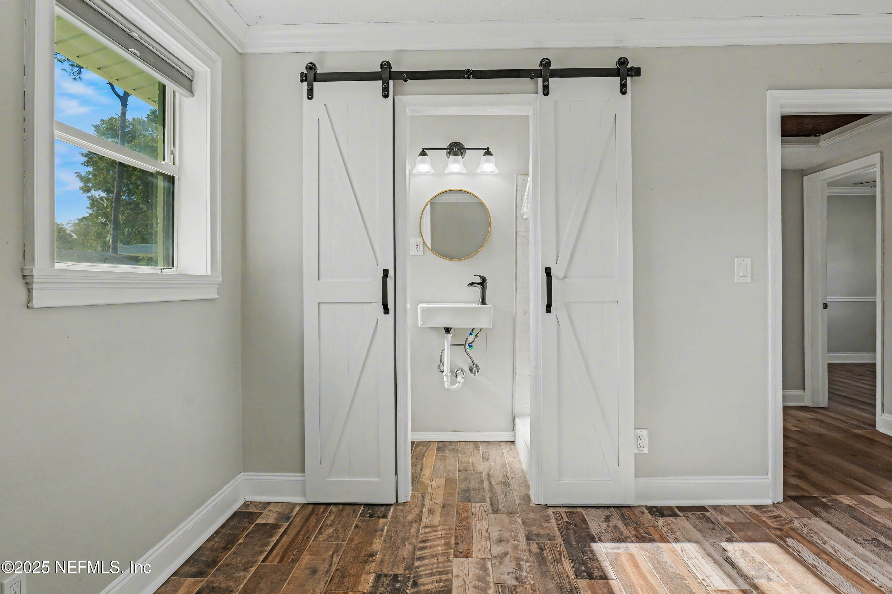 10640 Hemming Road Jacksonville, FL 32225 - Photo 13 of 46 a view of a hallway with wooden floor and closet