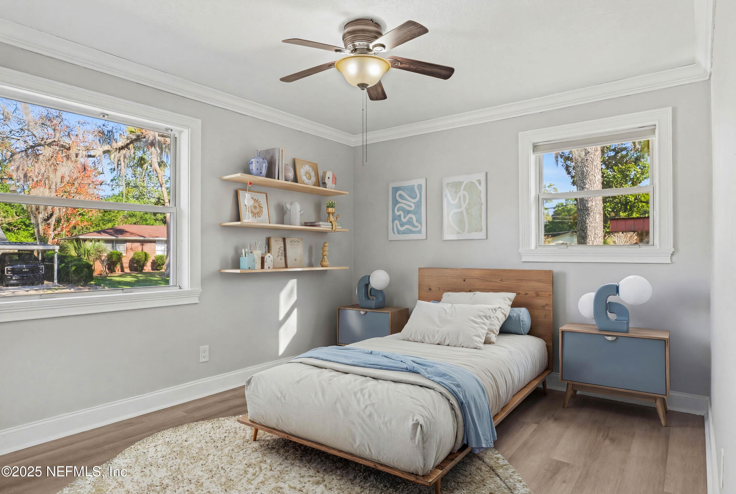 10640 Hemming Road Jacksonville, FL 32225 - Photo 15 of 46 a bedroom with a bed and a chandelier