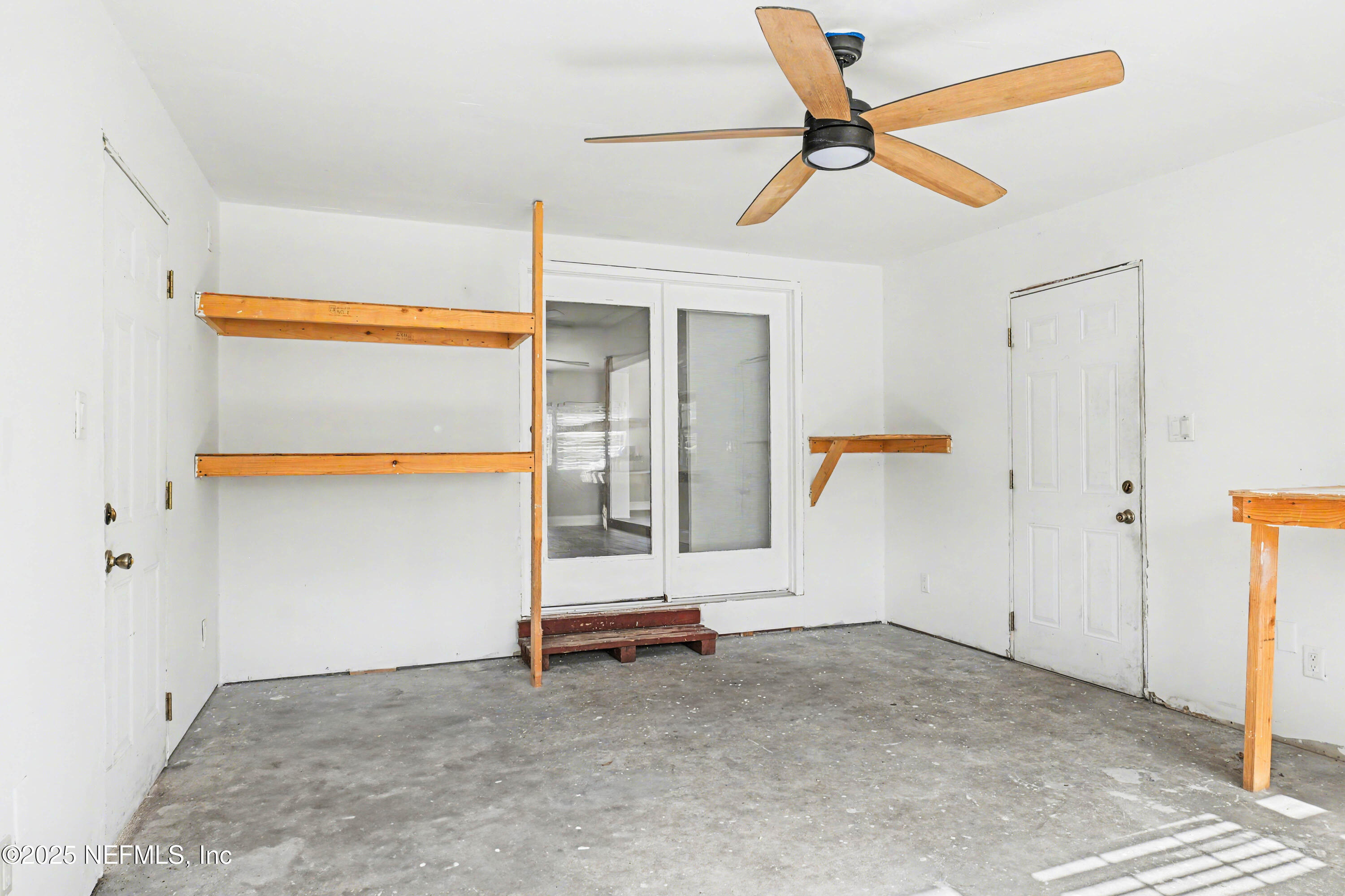 10640 Hemming Road Jacksonville, FL 32225 - Photo 22 of 46 an empty room with ceiling fan and window