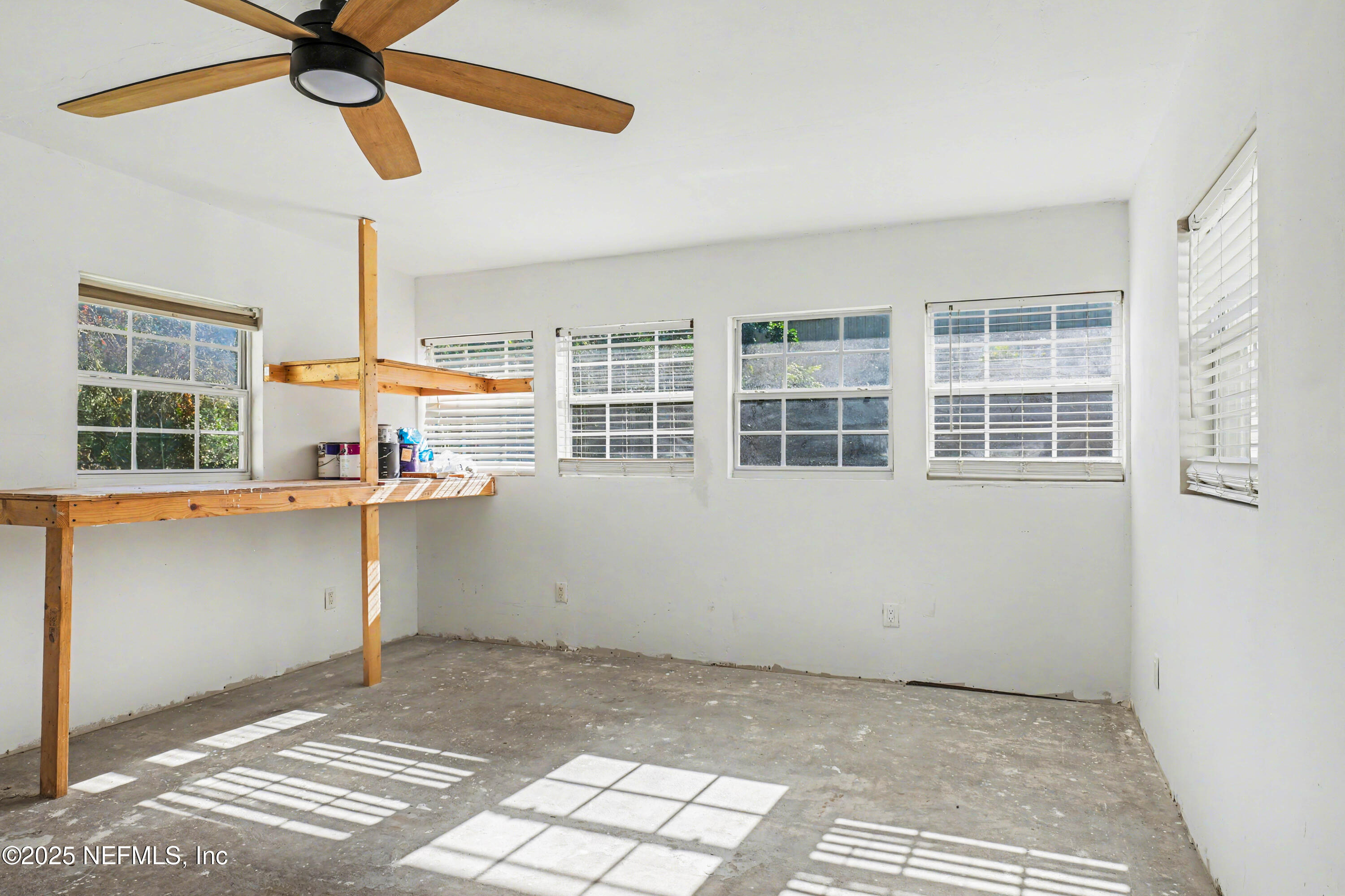 10640 Hemming Road Jacksonville, FL 32225 - Photo 23 of 46 a view of empty room with a window and ceiling fan