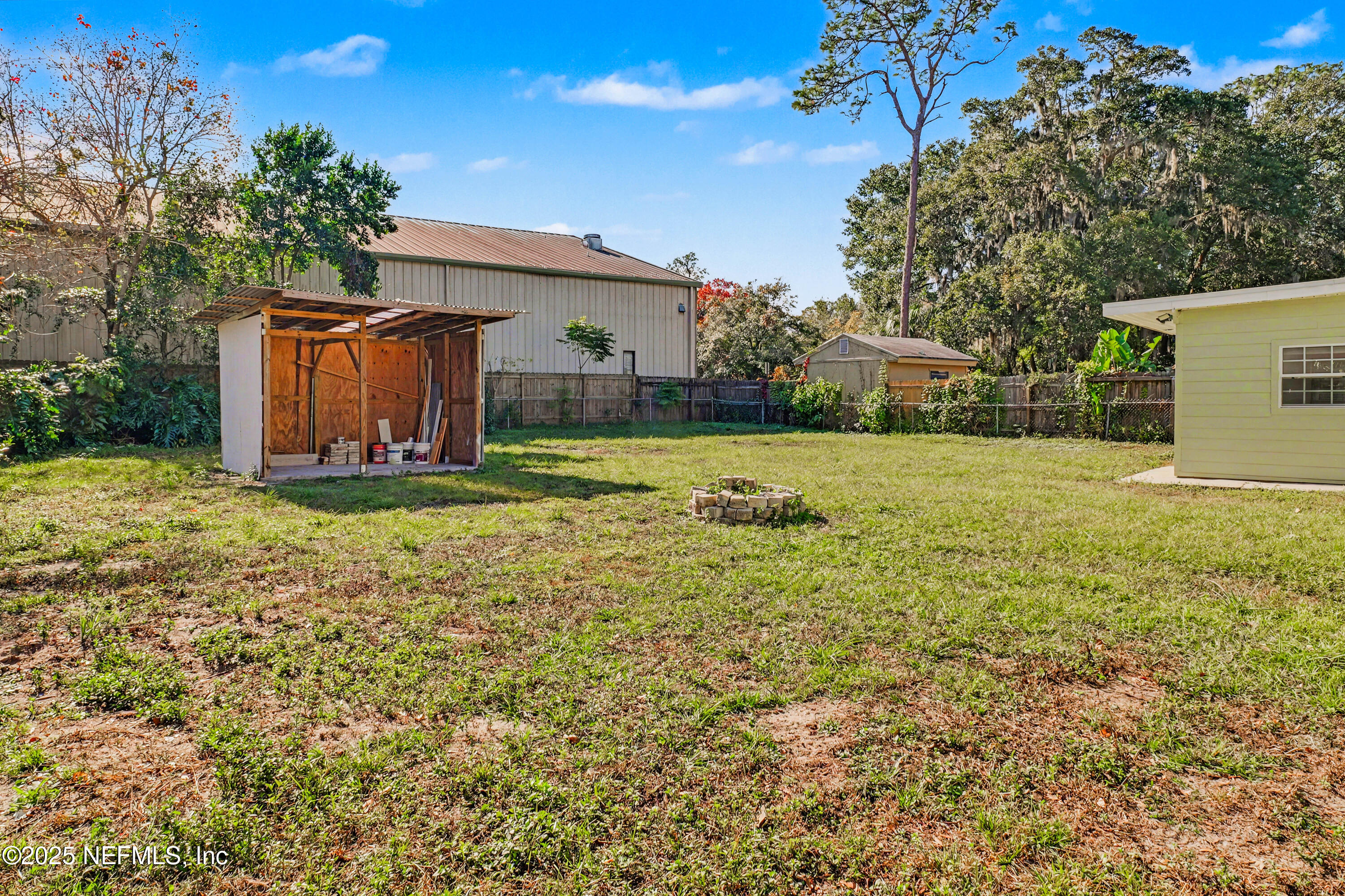 10640 Hemming Road Jacksonville, FL 32225 - Photo 26 of 46 a view of a house with a yard