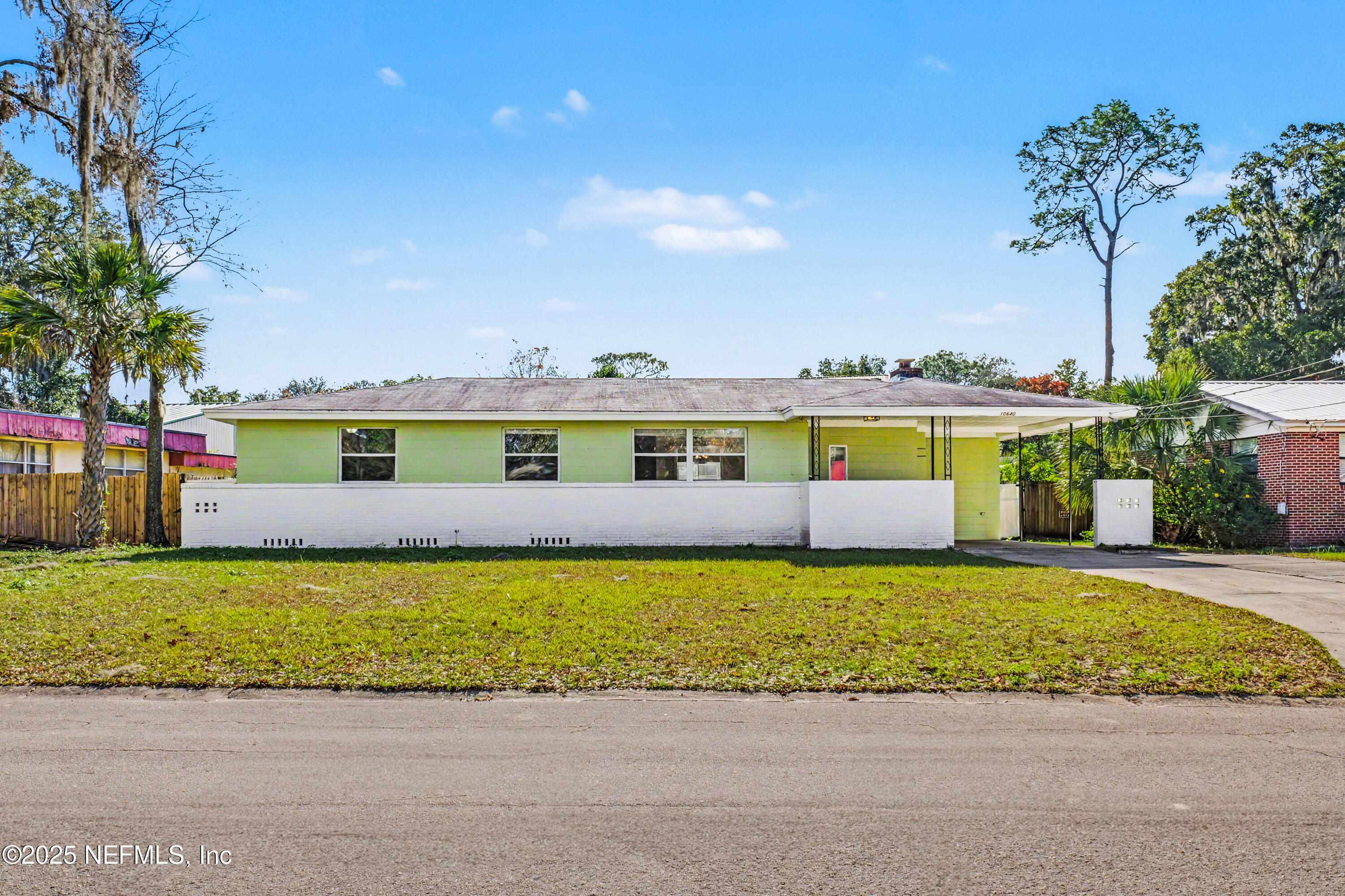 10640 Hemming Road Jacksonville, FL 32225 - Photo 34 of 46 a front view of a house with a yard and balcony