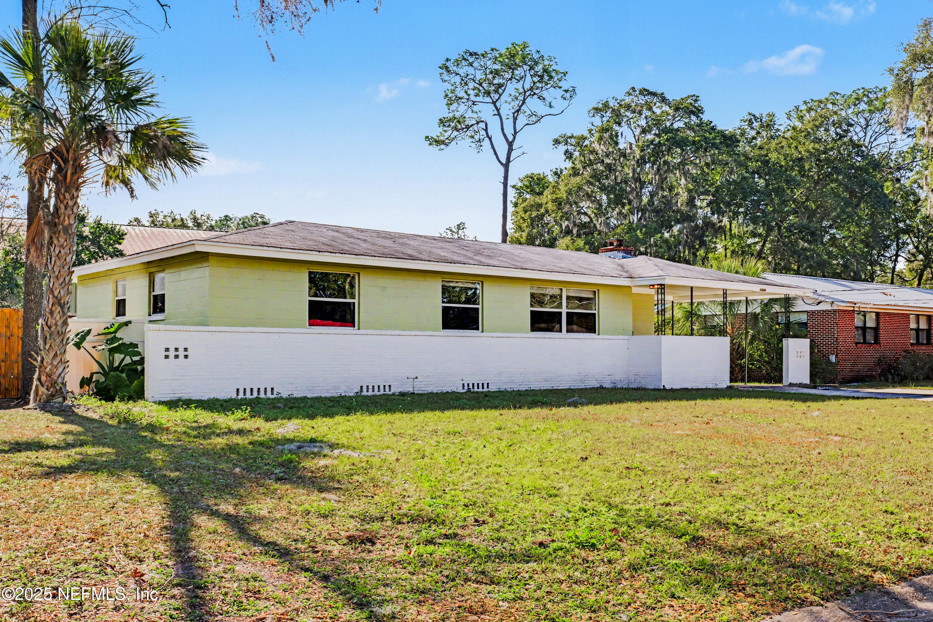 10640 Hemming Road Jacksonville, FL 32225 - Photo 35 of 46 a front view of house with yard and trees in the background