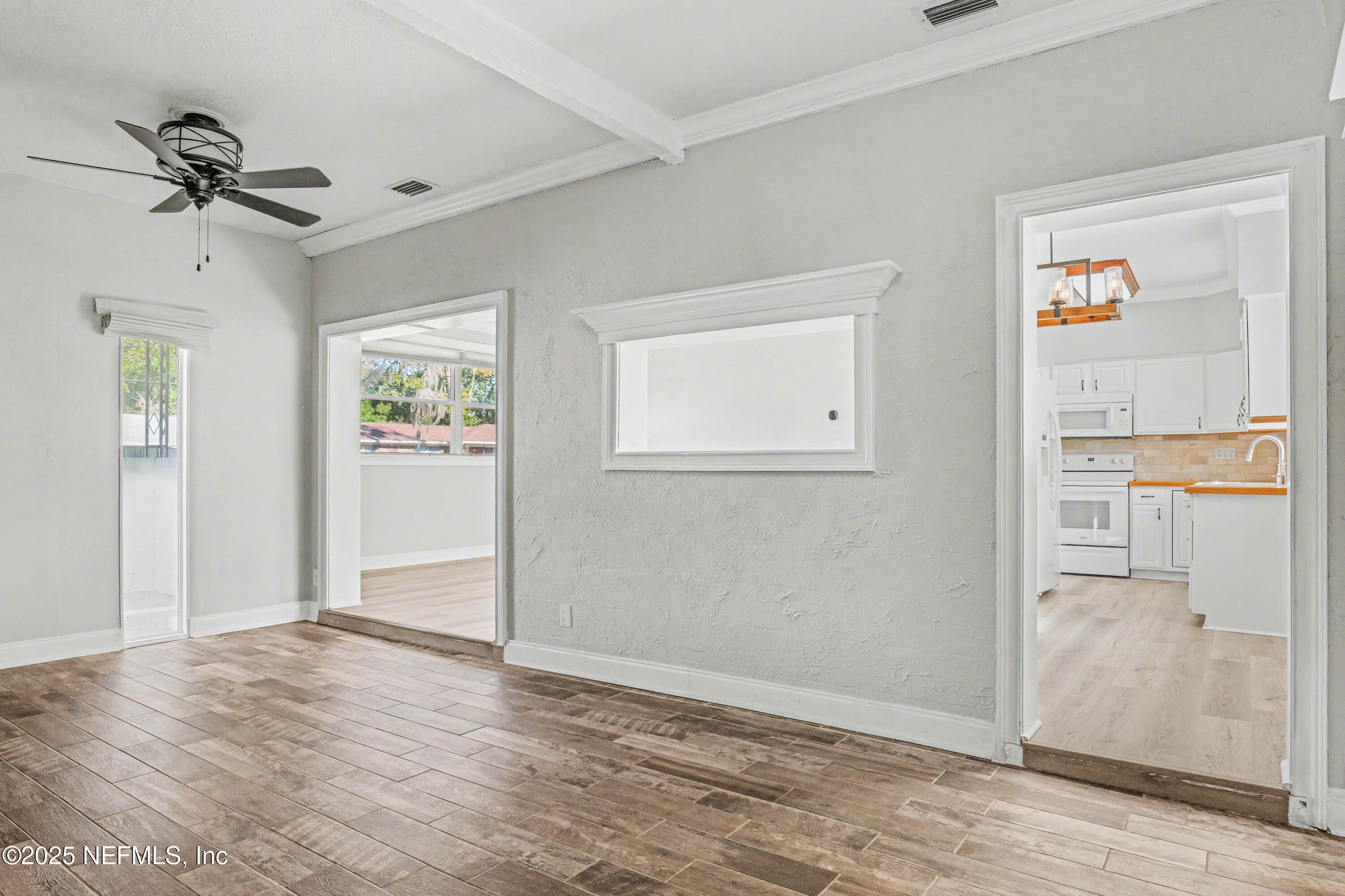 10640 Hemming Road Jacksonville, FL 32225 - Photo 37 of 46 an empty room with windows and entrance