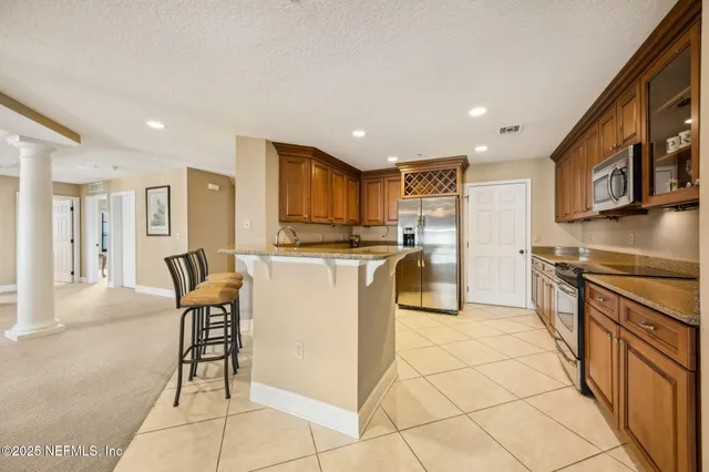 a bathroom with a sink a toilet a shower and a mirror