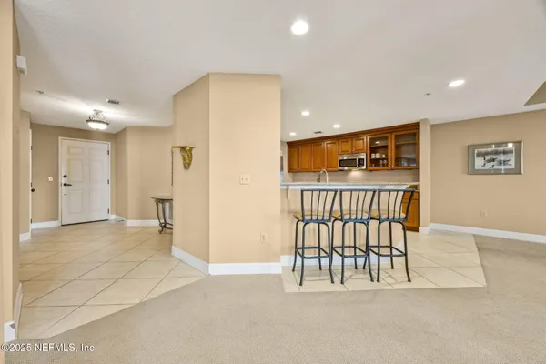 a view of a hallway with wooden shelves
