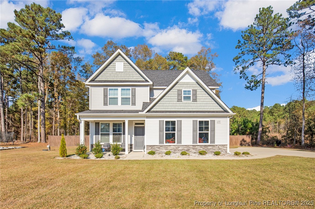 front view of a house with a yard