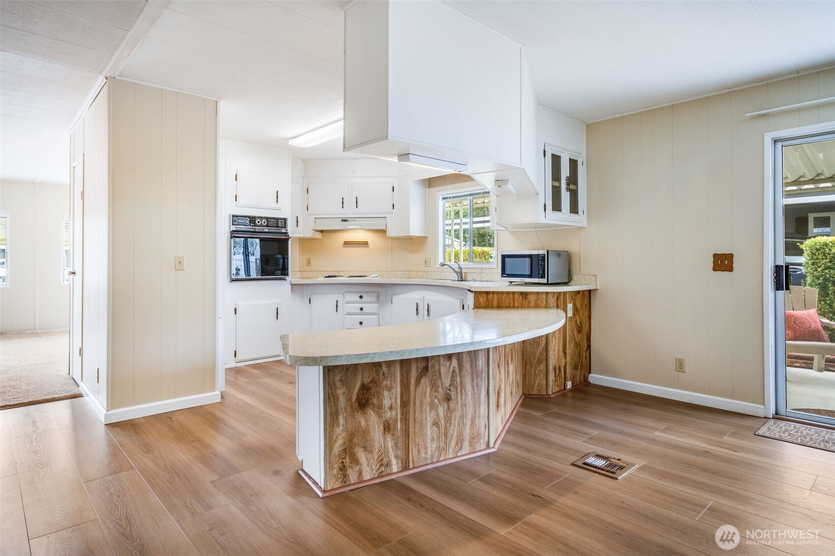 201 Union Avenue Southeast, Unit 111 Renton, WA 98059 - Photo 12 of 40 a kitchen with stainless steel appliances granite countertop a sink a stove a refrigerator and cabinets
