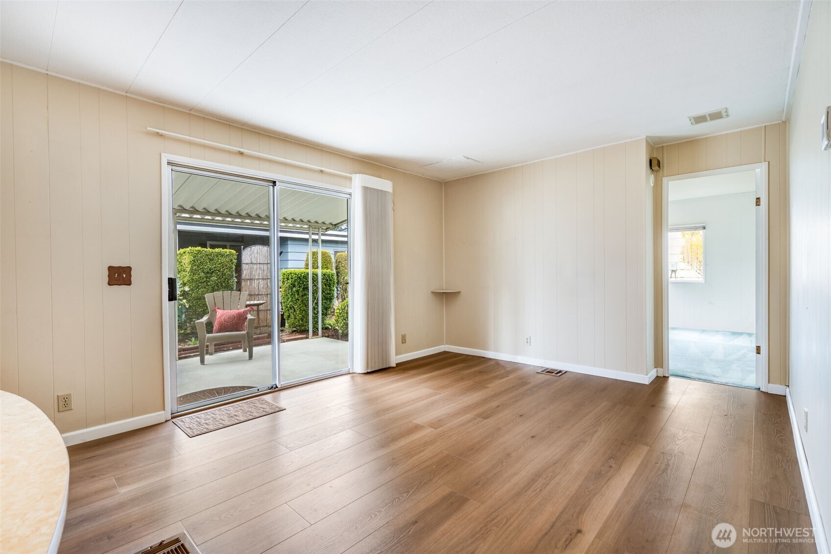201 Union Avenue Southeast, Unit 111 Renton, WA 98059 - Photo 14 of 40 an empty room with wooden floor and windows