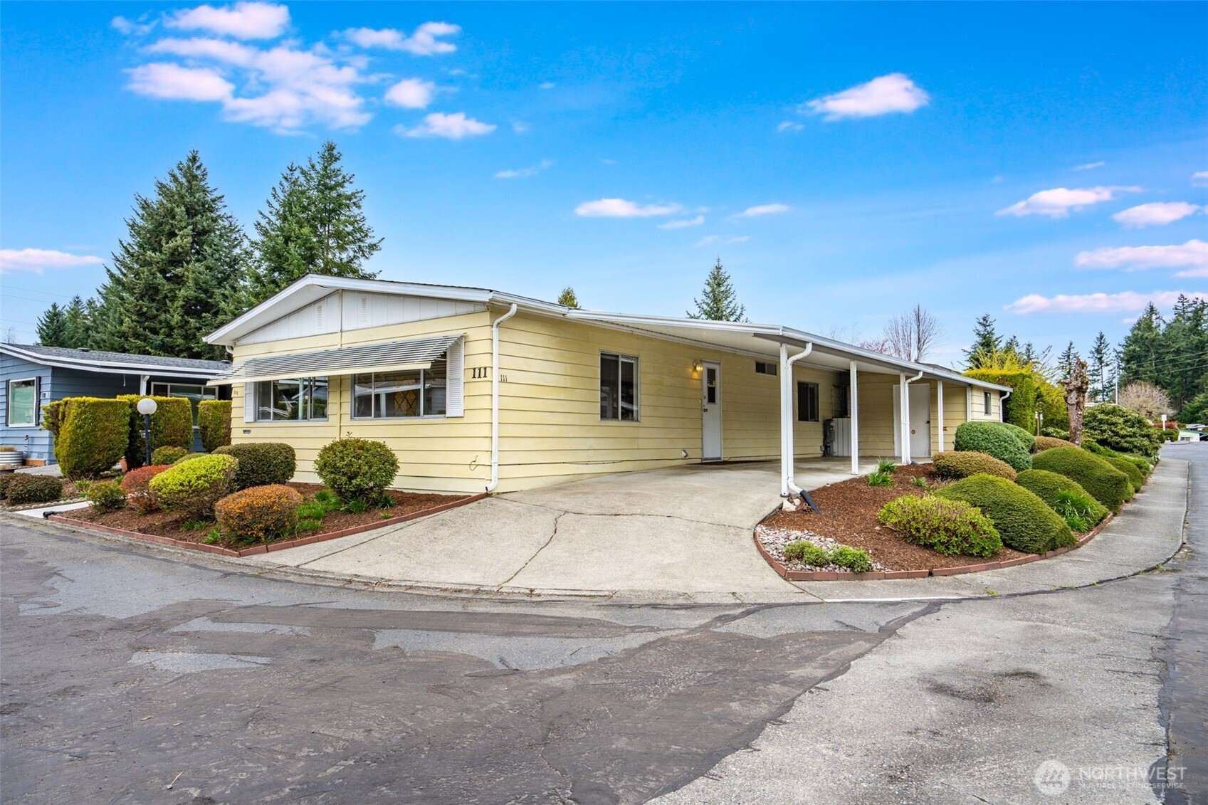 201 Union Avenue Southeast, Unit 111 Renton, WA 98059 - Photo 2 of 40 a view of a house with backyard and sitting area
