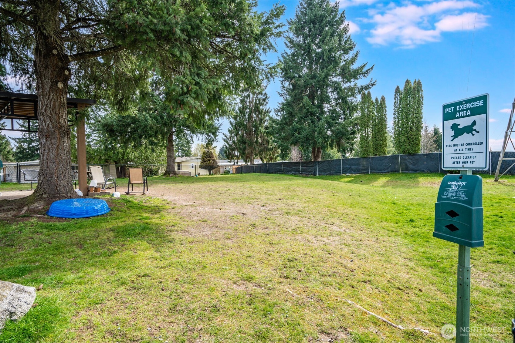 201 Union Avenue Southeast, Unit 111 Renton, WA 98059 - Photo 37 of 40 a view of a pool with an outdoor space and seating area