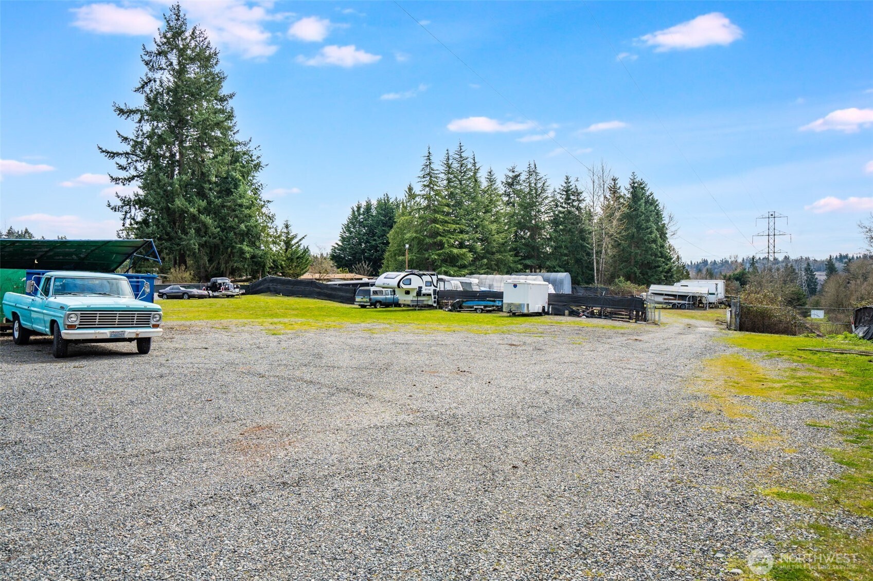 201 Union Avenue Southeast, Unit 111 Renton, WA 98059 - Photo 39 of 40 a view of a swimming pool with lawn chairs and plants