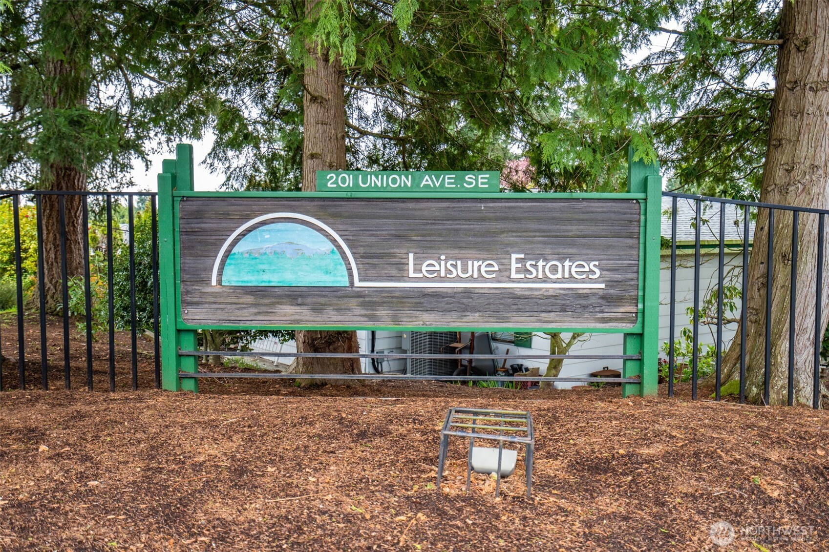 201 Union Avenue Southeast, Unit 111 Renton, WA 98059 - Photo 40 of 40 a view of a street with potted plants and large trees