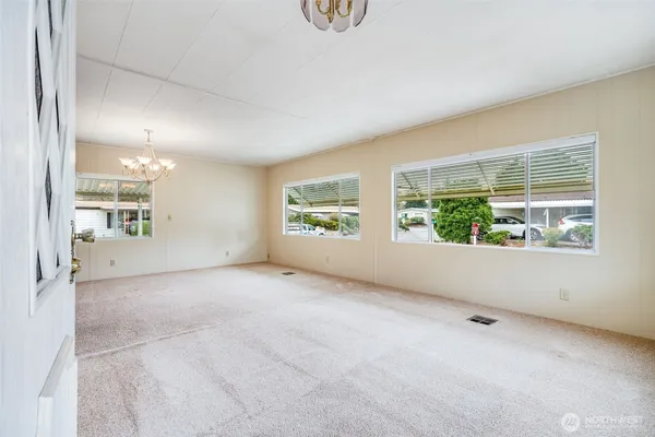 a view of an empty room with a window