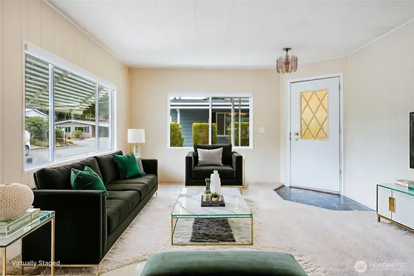 a living room with furniture and a large window