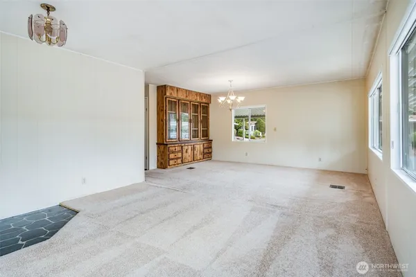 a view of a dining room with furniture window and outside view