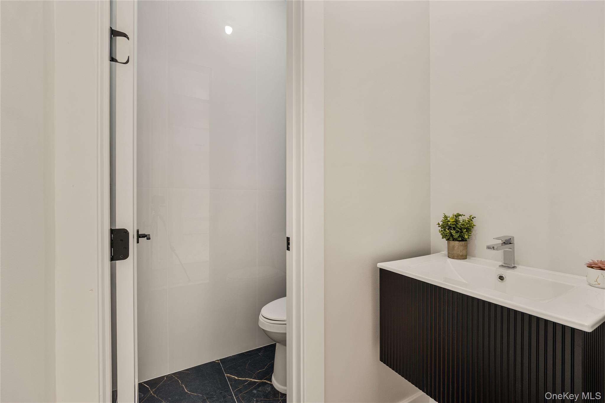 17 Lazer Court, Unit 202 Spring Valley, NY 10977 - Photo 13 of 40 a bathroom with a sink and a toilet