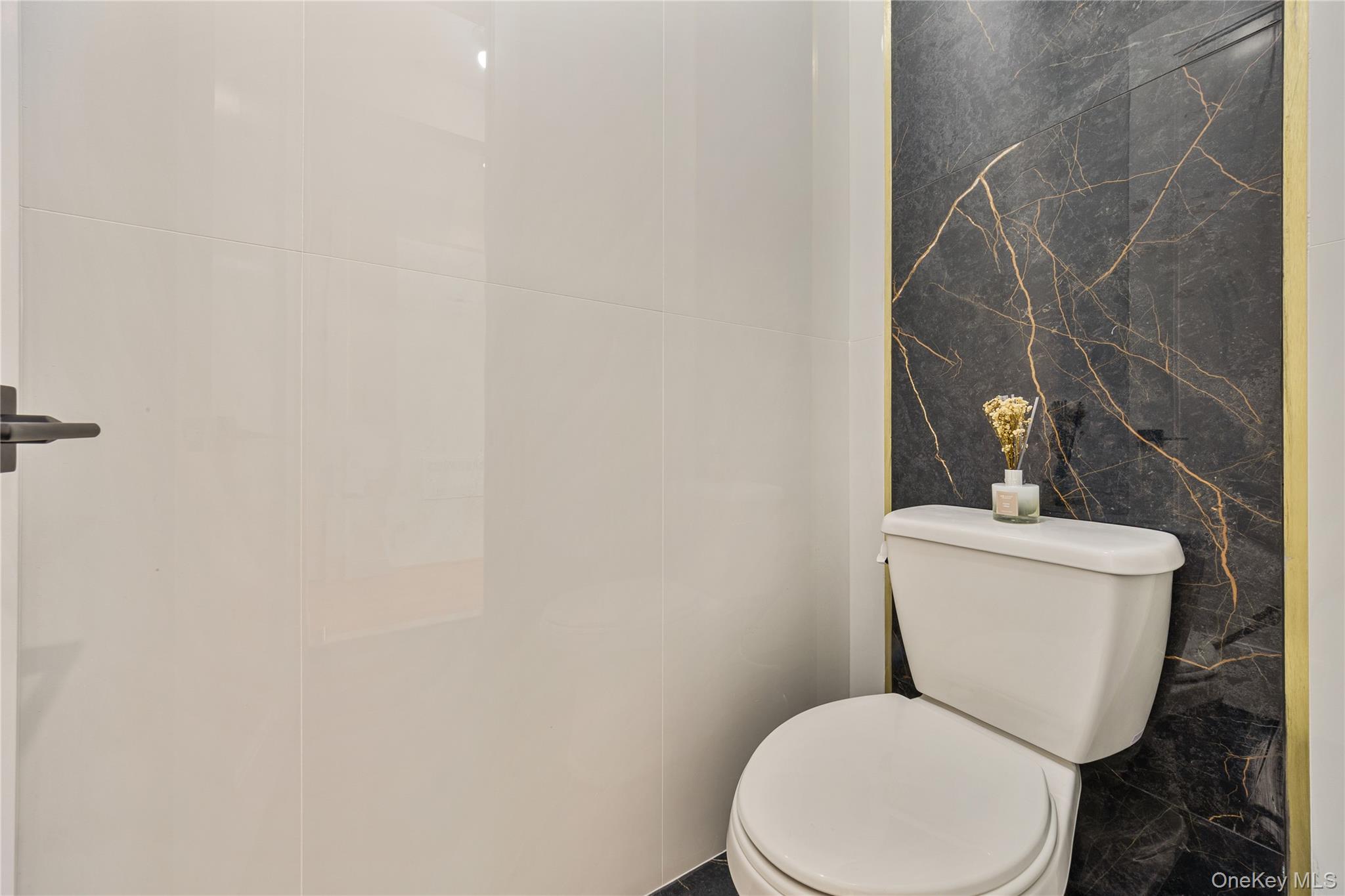 17 Lazer Court, Unit 202 Spring Valley, NY 10977 - Photo 14 of 40 a white toilet sitting next to a white wall