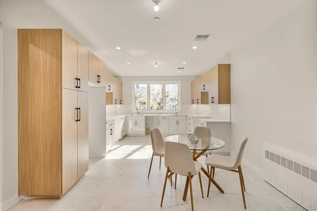 a view of a dining area with furniture and wooden floor