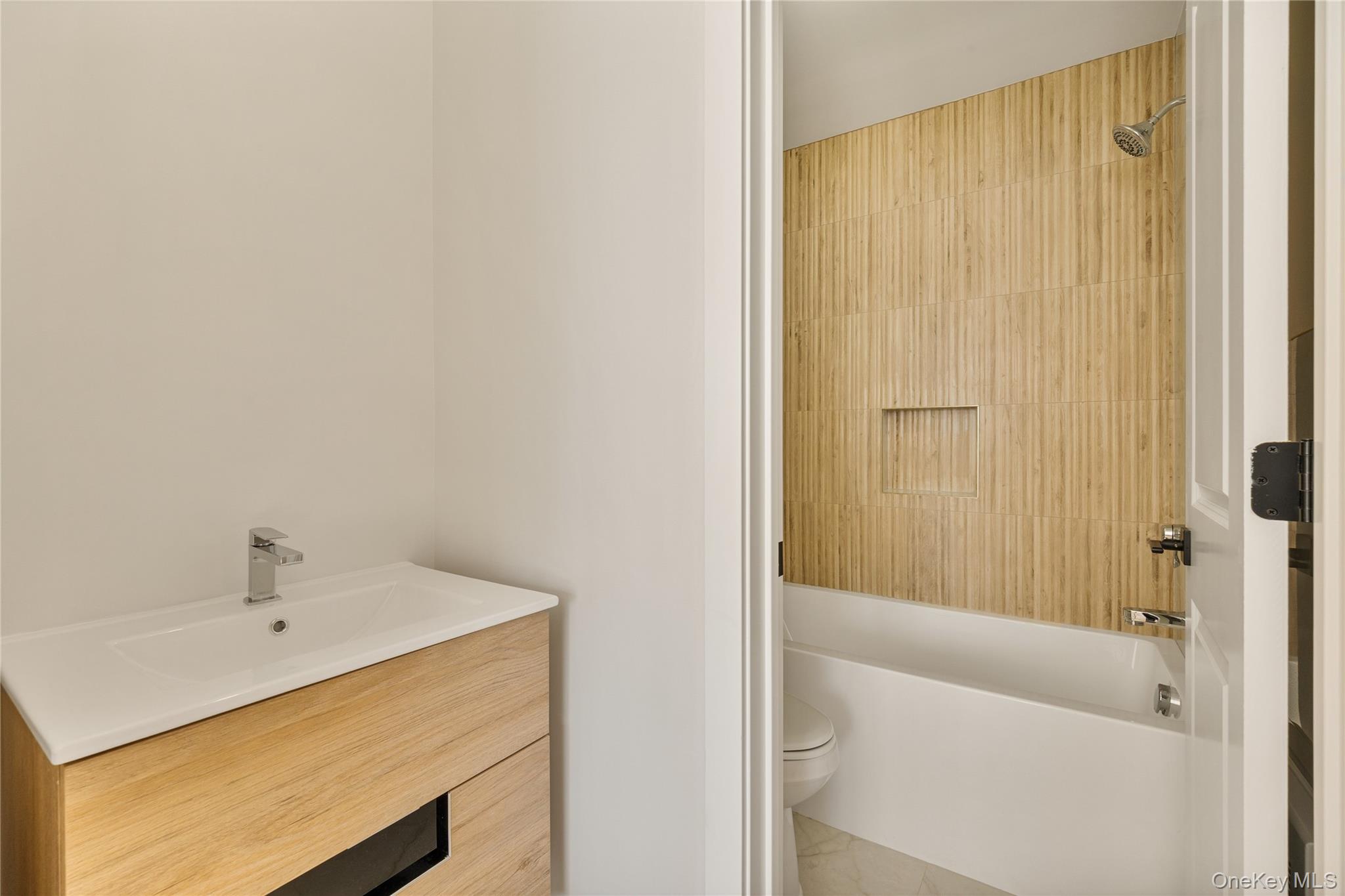 17 Lazer Court, Unit 202 Spring Valley, NY 10977 - Photo 29 of 40 a bathroom with a bathtub and shower