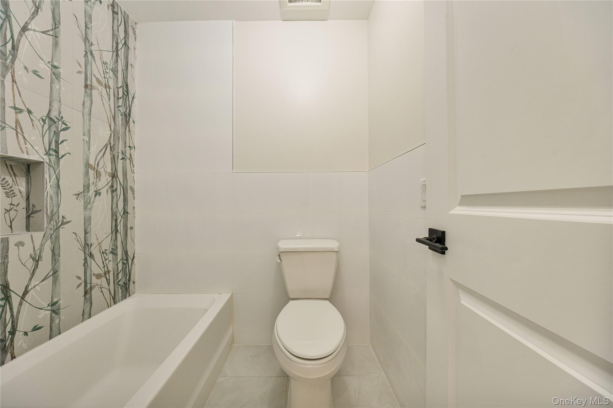 17 Lazer Court, Unit 202 Spring Valley, NY 10977 - Photo 38 of 40 a bathroom with a toilet and a bathtub