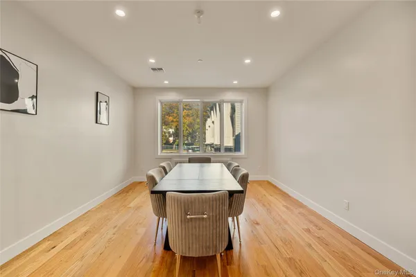 a room with wooden floor and furniture