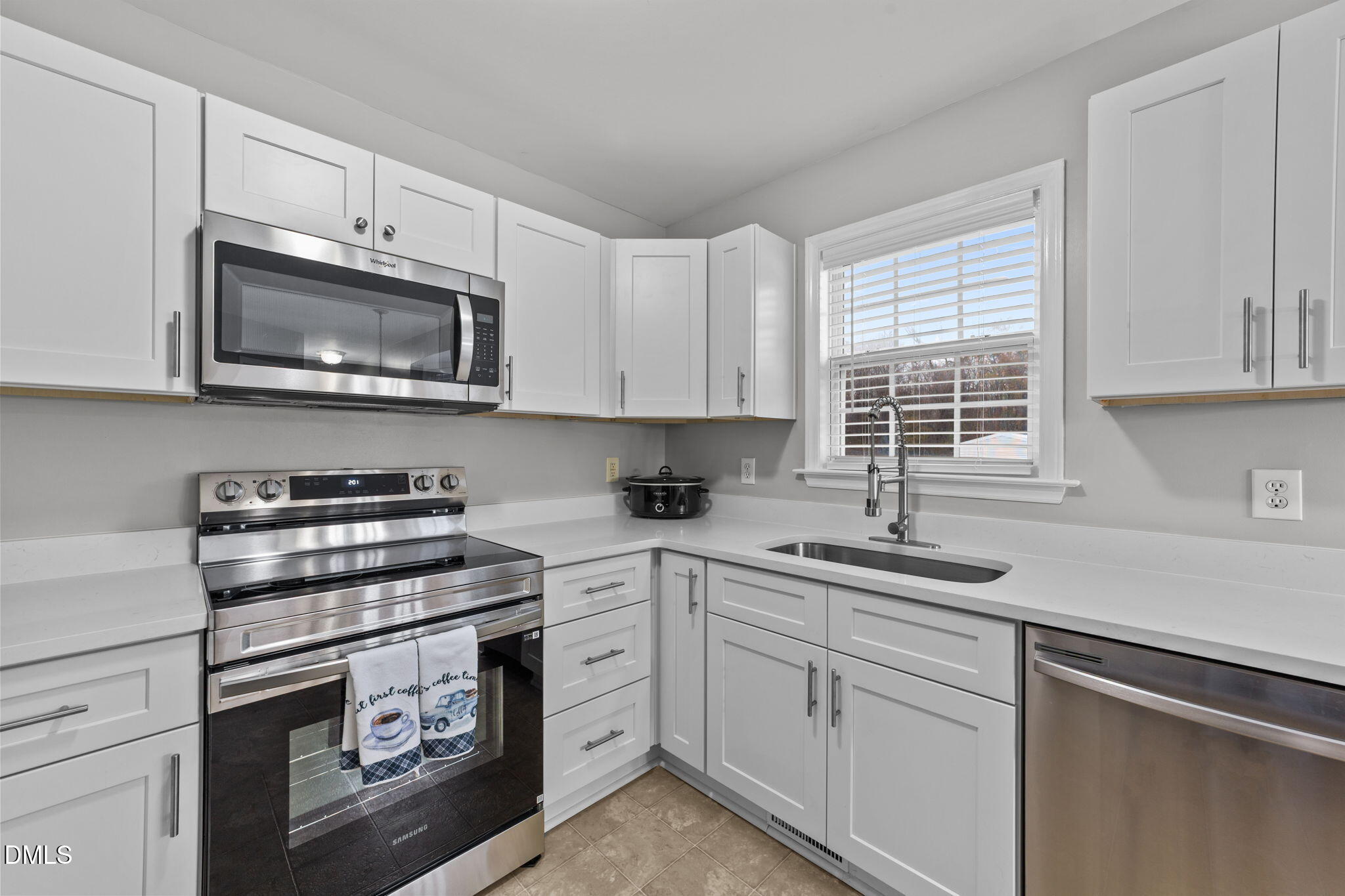 1275 Smith Road Smithfield, NC 27577 - Photo 11 of 41 a kitchen with cabinets stainless steel appliances a sink and a window