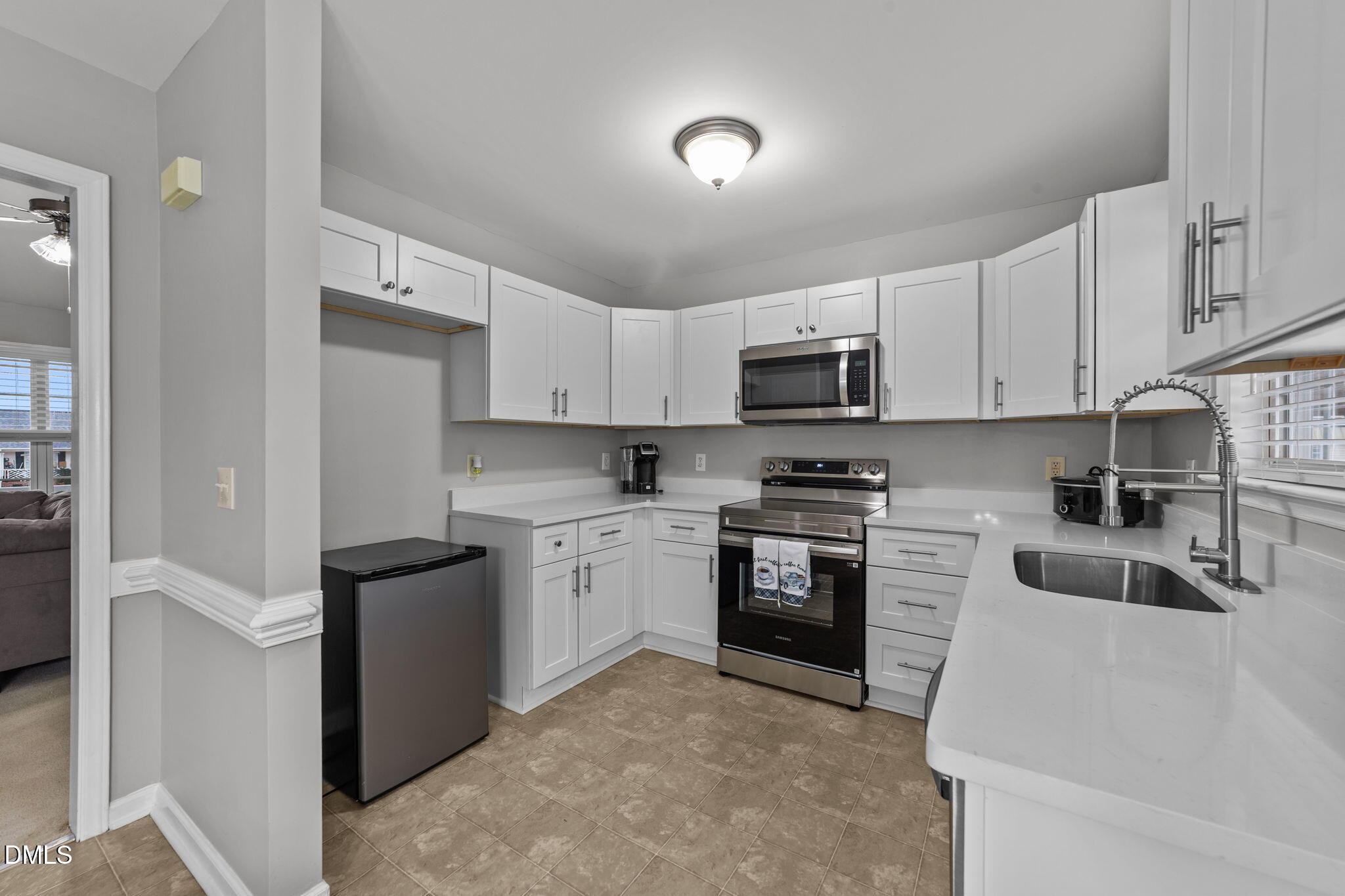 1275 Smith Road Smithfield, NC 27577 - Photo 13 of 41 a kitchen with granite countertop white cabinets and stainless steel appliances