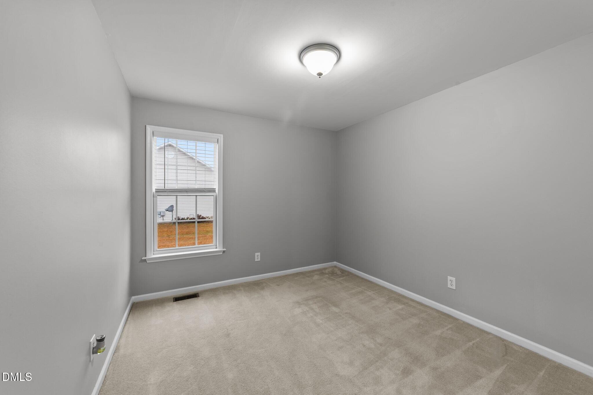 1275 Smith Road Smithfield, NC 27577 - Photo 28 of 41 an empty room with a window