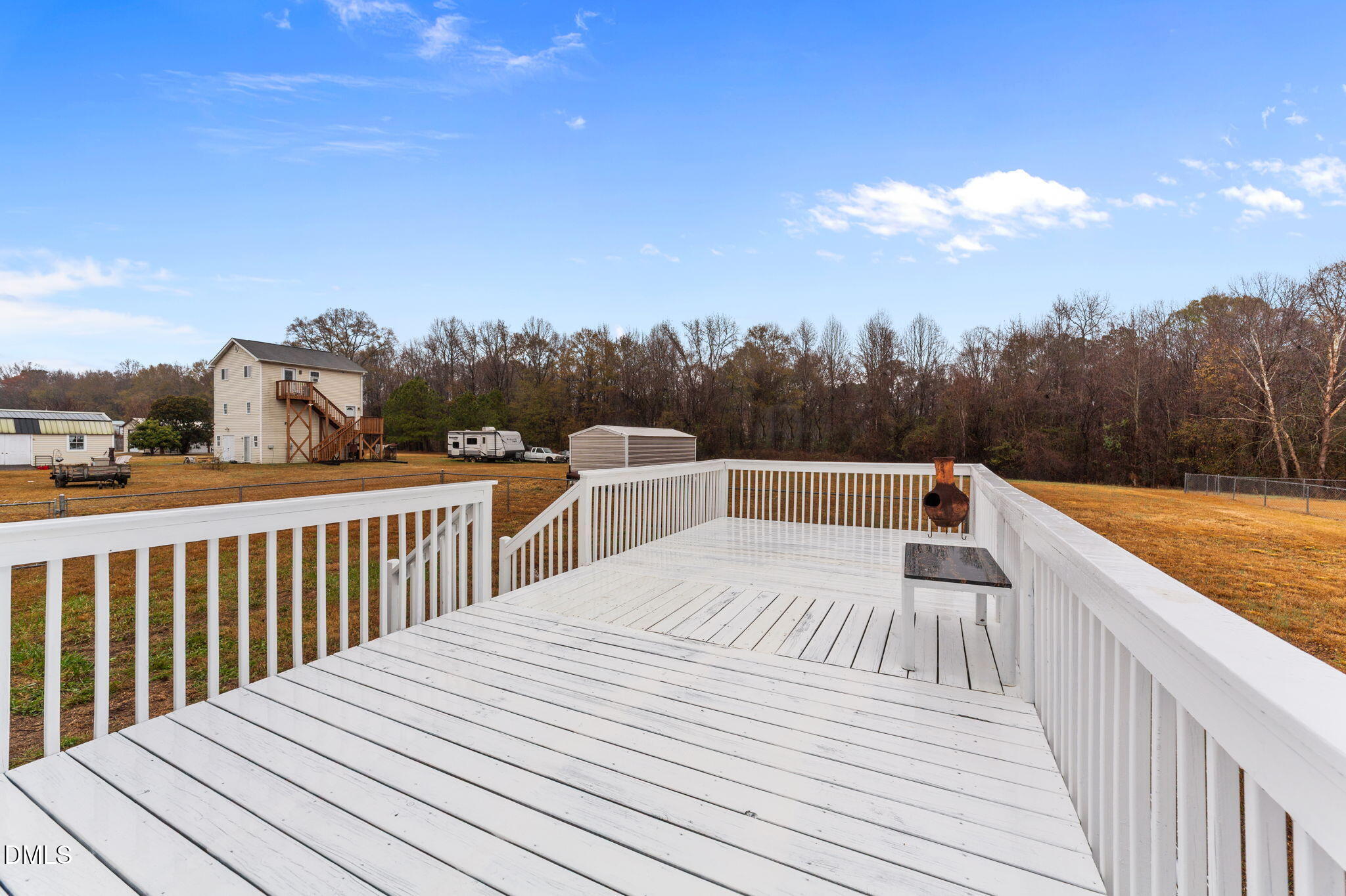 1275 Smith Road Smithfield, NC 27577 - Photo 30 of 41 a view of a wooden deck and a yard