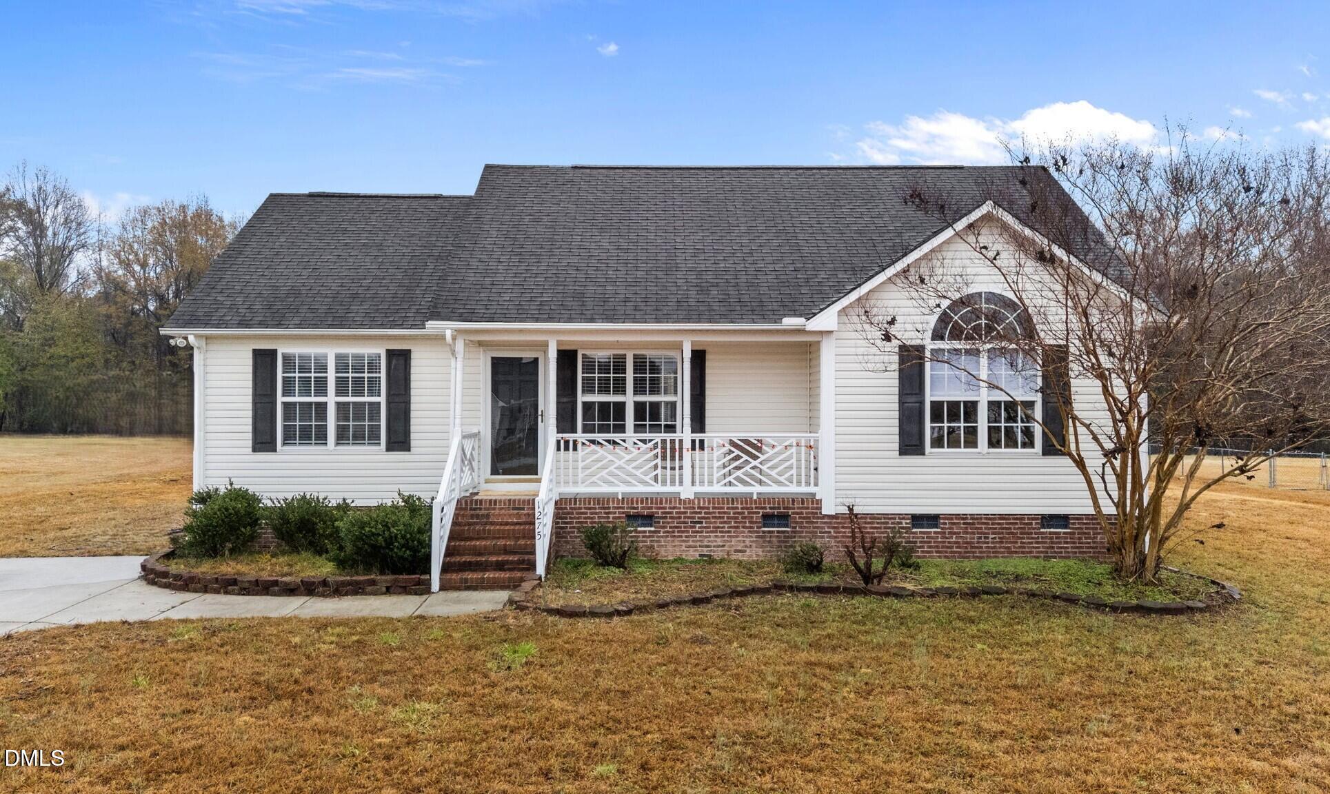 1275 Smith Road Smithfield, NC 27577 - Photo 32 of 41 a view of a house with a yard