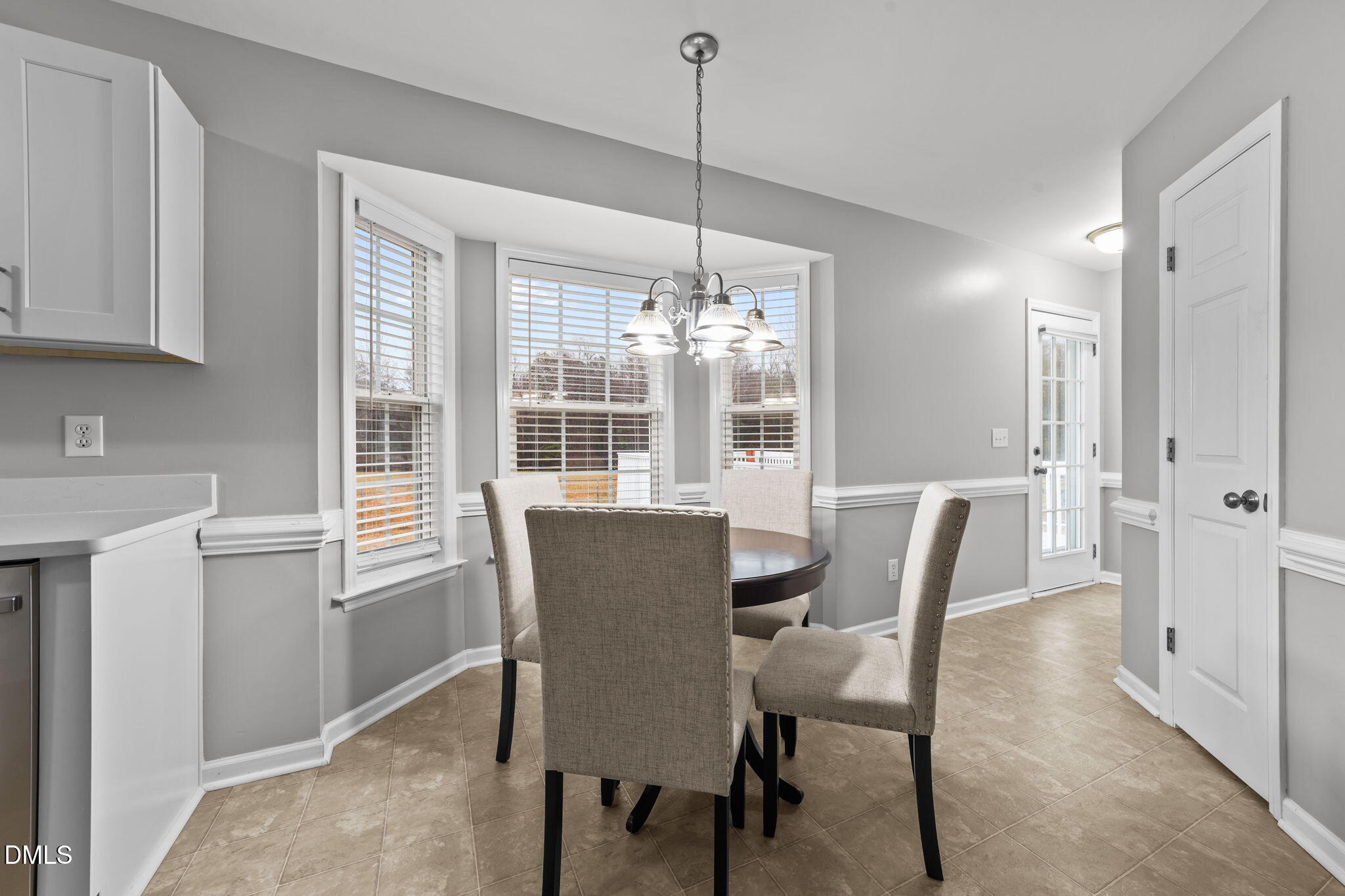 1275 Smith Road Smithfield, NC 27577 - Photo 8 of 41 a view of a dining room with furniture window and wooden floor