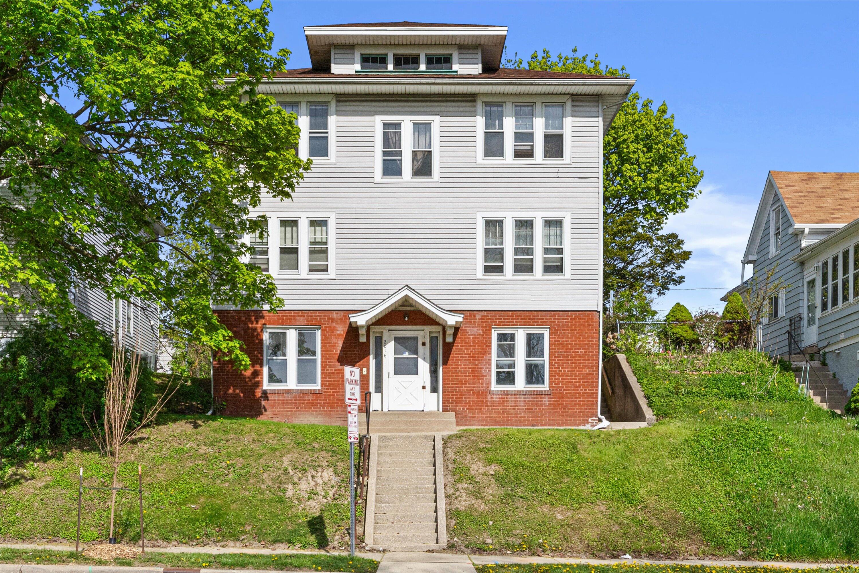 2016 Kinzie Avenue Racine, WI 53405 - Photo 1 of 1 Stately multi-unit with strong curb presence, clean siding, and elevated entry—an eye-catching investment with timeless character and solid rental appeal.