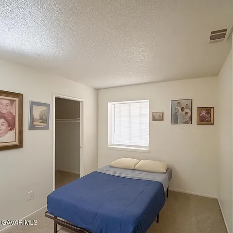 a view of hallway with wooden floor
