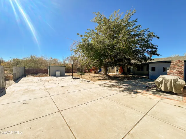 a view of a house with snow on the road