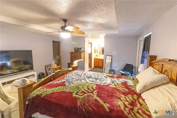 a bed room with a bed and a couch